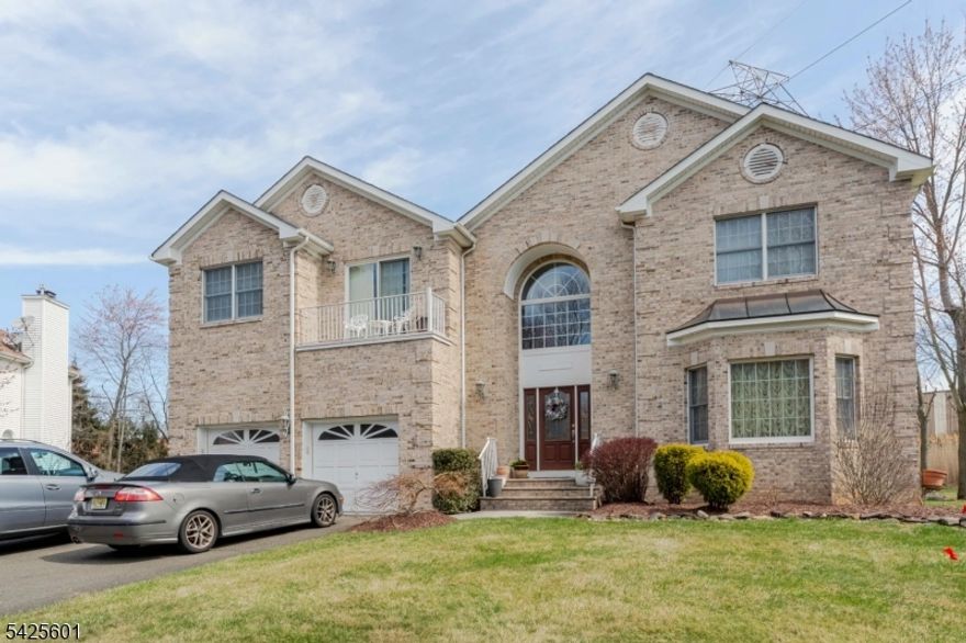 Welcome home to this beautiful center hall colonial that is nestled in a quiet cul-de-sac of Lincoln Estates in the prestigious East Hanover. Newer construction, 17 years young with its original owner, who displays pride in ownership by meticulously upkeeping the property, you are sure to appreciate the gleaming hardwood floors that span the entire 1st floor, which is both spacious and luminous with natural light emanating from the windows. A two-car garage is situated on the left side of the home, which offers privacy, convenience, and protection from unfavorable weather conditions. Let's appreciate the expansive sunken great room that emanates class and comfort, the opulent powder room, and laundry room all to the left of the 1st floor. On the right side are the study, the formal living and dining rooms that lead to the breakfast nook area, and the stately kitchen loaded with stainless steel appliances and solid wood designer cabinets with granite counters, an Island with ambient lighting, and a beverage bar. The 2nd floor boasts an ensuite expansive primary bedroom with its own balcony, tons of natural light, double walk-in closets, and a luxurious bathroom with a jacuzzi bath, private throne room, double sinks, and a shower. Down the hallway are 3 other generously sized bedrooms and 2 bathrooms. Pack and move right in this practical and functional house that has a huge yard space and a basement with high ceilings.  you will be proud to call this your home.