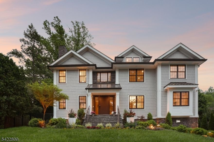 Welcome to 290 Long Hill Drive, an exceptional build completed in 2021. This blend of luxury, comfort & functionality is a labor of love. Sited perfect on over half an acre of Short Hills property with 7 beds & 8.1 baths boasts a heated saltwater pool w/ hot tub, gazebo & equipped custom outdoor kitchen! Soaring ceilings, gracious formal rooms with built-ins and gleaming hardwood floors invite you to share their light & warmth. The living room features  gas fireplace, large dining room with butler's pantry is perfect for holidays & dinner parties. The heart of the home features a custom walnut and stainless steel chef's kitchen outfitted with top Miele appliances, 4 electric ovens, a steamer, 2 cafe-style refrigerators, & 2 dishwashers. Large eating area makes hosting a pleasure and the spacious family room with built in cabinetry & sliders to the backyard create an elegant lifestyle while the Sonos speakers enhance the experience. Spacious guest suite, private office & guest powder room complete the 1st level. The 2nd floor hosts 5 en suite bedrooms with heated bathroom floors & ample closets. The primary features a comfortable bedroom leading to private deck, luxurious bathroom & custom closet! Spacious 3rd level provides flex space perfect for a home office/recreation room. The lower level, a home theater, wine cellar & music room elevate your living alongside a private gym & rec area. An en suite bedroom & laundry complete this level. This is luxury living at its finest.
