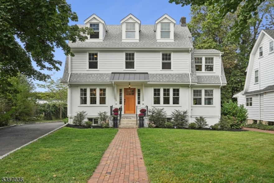 LOCATION, LOCATION, LOCATION...Welcome to this charming Dutch Colonial home that blends timeless charm with tasteful modern improvements.This Northside four bedroom, two full and two half bath home is nestled on one of Summit's beautiful tree-lined streets just steps to downtown. completely gut renovated in 2011 with all new plumbing, electric, forced hot/cold air HVAC, sewer line, oil to gas conversion, installed generator panel and electric car charger, insulation and new windows on 1st, 2nd and lower level floors. Most recent upgrades (2023) include new roof, addition of 3 dormers to front of house, new windows throughout 3rd floor, new gutters and guards, Hardie board siding on 2nd & 3rd floor with Azek trim and a new front door.