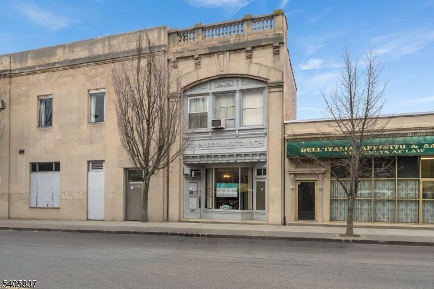 Commercial building for sale in the heart of Orange, NJ. This classic masonry property features excellent street visibility with a functional and flexible layout suitable for a variety of professional uses. A great opportunity for investment or owner-use with potential for value-add improvements in a high-demand commercial corridor! The current interior layout offers two separate units each with their own entrance and bathroom. The lower level has valuable bonus space including a large storage area and another bathroom. Ideally positioned close to  NJ Transit train station and the Midtown Direct train to Manhattan, with convenient access to major roadways including I-280, the Garden State Parkway, and routes to Newark and New York City.