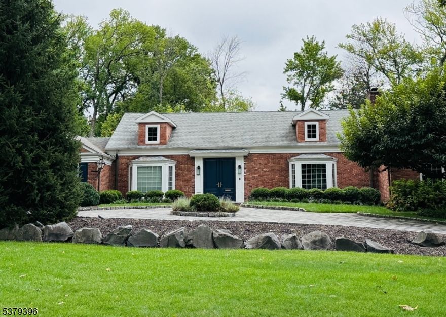 FOR COMP PURPOSES ONLY. Beautifully Updated Ranch on a Premier Cul-de-Sac. Set on nearly an acre of landscaped grounds, this thoughtfully updated ranch blends comfort, style, and convenience. The main level welcomes you with an elegant entry foyer leading to a sun-drenched sitting area and a gracious formal dining room, complete with a fireplace. At the heart of the home, the chef's kitchen is a true showpiece, featuring a center island, abundant counter space, custom cabinetry, and direct access to the bluestone patio. The kitchen seamlessly flows into the spacious family room, where a second fireplace and walls of windows create an inviting atmosphere. Privately situated in its own wing, the primary suite offers a serene retreat with a walk-in closet and full bath. Two additional bedrooms and a full hall bath complete the sleeping quarters. A stylish powder room and mudroom provide added convenience on the first floor. The finished lower level expands the living space with a generous recreation room, home office, full bath, laundry, and two large storage areas, offering exceptional versatility. Outdoors, the circular paver driveway and attached two-car garage enhance both curb appeal and everyday ease. Ideally located close to town, top-rated schools, and NYC transportation, this exceptional property truly has it all.