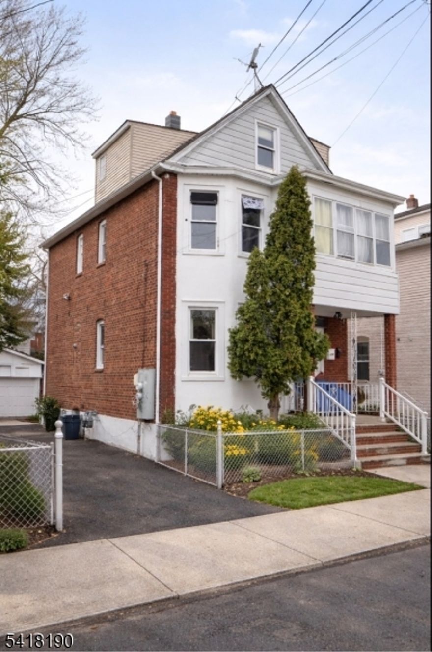 Great investment or owner-occupant opportunity! Live in one unit and rent the other for additional income. Features finished attic and basement for extra space. Includes driveway and 1-car garage. Convenient location near shopping and parks. Some photos have been virtually staged to illustrate the potential of the home.