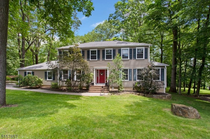 Stately Colonial on one of Randolph's nicest streets.  This lovingly cared for 4 bed 2 and 1/2 bath home has a large entry foyer with 2 coat closets.  The foyer opens to the formal living room with hardwood floors on the right and formal dining room on the left also with hard wood floors.  The dining room has wainscoting and and indented wall for your hutch. The large country eat in kitchen is just off the dining room.  Large double pantry and newer stainless appliances and sliders to the Trex Deck make this a kitchen everyone will want to spend time in.  A large laundry room leading to the garage makes for easy transfer of groceries from the car to kitchen. Relax in the family room off the kitchen with a wood burning fireplace.  This home has great flow and built for entertaining  Almost all the windows have been replaced with Andersen windows.   The upstairs has a nicely carpeted primary bedroom with en suite and 3 large bedrooms with hard wood floors and a main bath.  Both baths have been refreshed with new cabinets and sinks. A poured concrete foundation in the unfinished basement is waiting for you to add your touches. Gorgeous park like yard and very private wooded back yard to enjoy.  Randolph School System and close to rts 10, 46, and 80.  A must see if you are looking for class elegance and well cared for home in a sought after area.