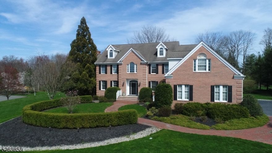 (Back on the market with a brand new deck and the pool is now open.) Nestled majestically in a neighborhood just outside of Princeton on a sprawling two-acre lot of meticulously manicured grounds, this stately colonial offers an unparalleled blend of timeless elegance inside with the allure of resort-style living outside. Step inside to discover a haven of sophistication, where tall ceilings and gleaming hardwood floors create an ambiance of refined grandeur. A first floor guest suite complete with a fireplace and private bath is at one end of the home while formal rooms, a vaulted great room, commercial grade kitchen with center island and breakfast room with sliders open to a deck, patio and pool. Double staircases, lead to fantastic bonus room, a primary suite with a sitting room and dual closets, three more bedrooms, one ensuite and hall bath. Lower level has play spaces, gym, sauna room, full bathroom, a second cozy family room and plenty of storage space. Stunning gardens surround the Anthony-Sylvan Gunite pool for outdoor gatherings with plantings by Kale's Nursery.  This property offers a full three levels of gracious living with versatile space for recreation, entertaining, or simply to unwind. Located just ten minutes from the University Town of Princeton, where one can enjoy convenient access to shopping, dining and theater amenities.