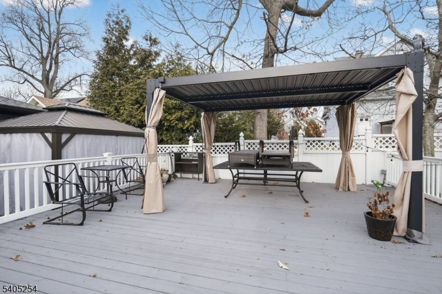 This well-maintained 5-bedroom, 3 full-bath residence offers the space, flexibility, and upgrades today's buyers demand. Thoughtfully designed for both everyday living and entertaining, the home features a large formal dining room ideal for hosting holidays, dinner parties, and gatherings. A private in-law suite with a separate entrance provides excellent options,or a dedicated home office setup. The interior showcases wood flooring and tile throughout, delivering durability, warmth, and timeless appeal. An open-concept kitchen anchors the main living space and is equipped with stainless steel appliances, generous cabinetry, and a layout that keeps you connected while entertaining or managing daily routines.In 2014, the home underwent a major renovation, introducing extensive updates and modern improvements that continue to add value and peace of mind. Additional highlights include an oversized garage with a dedicated work area, perfect for storage, hobbies, or projects. Conveniently located just minutes from Route 3, this property offers easy access to NYC, major highways, shopping, dining, and essential commuter routes making it an ideal choice for those seeking space without sacrificing convenience. This is a home that delivers comfort, functionality, and long-term value in a highly accessible location.