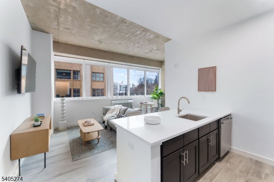 Experience Elevated Urban Living at Newark's Newest Luxury Mid-Rise. Welcome to The Mercer: a refined blend of industrial chic and modern comfort in the heart of Newark, NJ. This luxury mid-rise community redefines city living with spacious layouts, soaring ceilings, and striking exposed concrete accents that create an unmistakably upscale, urban aesthetic. Each beautifully designed residence features in-unit washer and dryer, sleek stainless-steel appliances, including a dishwasher, and oversized windows that flood your home with natural light. Thoughtful finishes and smart layouts ensure comfort, convenience, and style in every square foot. Step beyond your front door and enjoy an unmatched suite of amenities: State-of-the-art fitness center for daily workouts Co-working lounge perfect for remote work, collaboration, or quiet focus On-site caf , offering the ideal spot to start your day or unwind in the afternoonThis growing community is only getting better. Soon, residents will enjoy a full-service restaurant and an expansive roof deck, designed to offer stunning views and vibrant social spaces right at home. Perfectly situated near Newark's cultural destinations, transit hubs, parks, and dining, this building offers the ultimate blend of luxury, lifestyle, and location. Discover the next level of modern living right here in Newark.