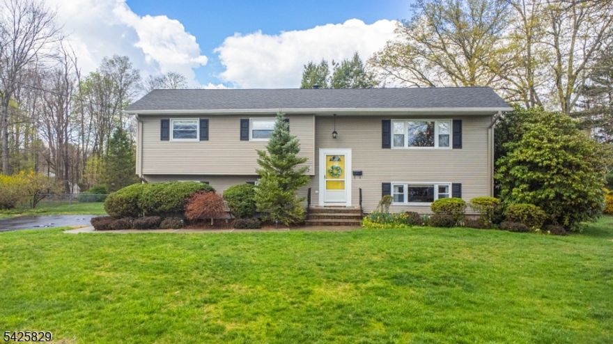 Welcome to this meticulously maintained 4-bedroom, 2 full bath bi-level home located in one of Roxbury's most desirable neighborhoods. This move-in ready property features a spacious 2-car garage and a thoughtfully designed addition off the back, creating a stunning oversized family room with vaulted ceilings perfect for entertaining or relaxing. The main living spaces offer beautiful hardwood floors and a well-appointed kitchen with granite countertops, combining style and functionality. Step outside to enjoy a covered patio beneath the addition, overlooking a large, fully fenced backyard ideal for gatherings, pets, or play. Additional highlights include public sewer, public water, and natural gas, along with a newer roof and newer central air conditioning for added peace of mind. Sidewalk-lined streets enhance the neighborhood feel, while the home's prime location offers convenient access to major highways, shopping, dining, and entertainment. Situated in a community known for its top-rated schools, strong athletics, and thriving arts programs, this home truly has it all. Just unpack and move right in this is the one you've been waiting for.