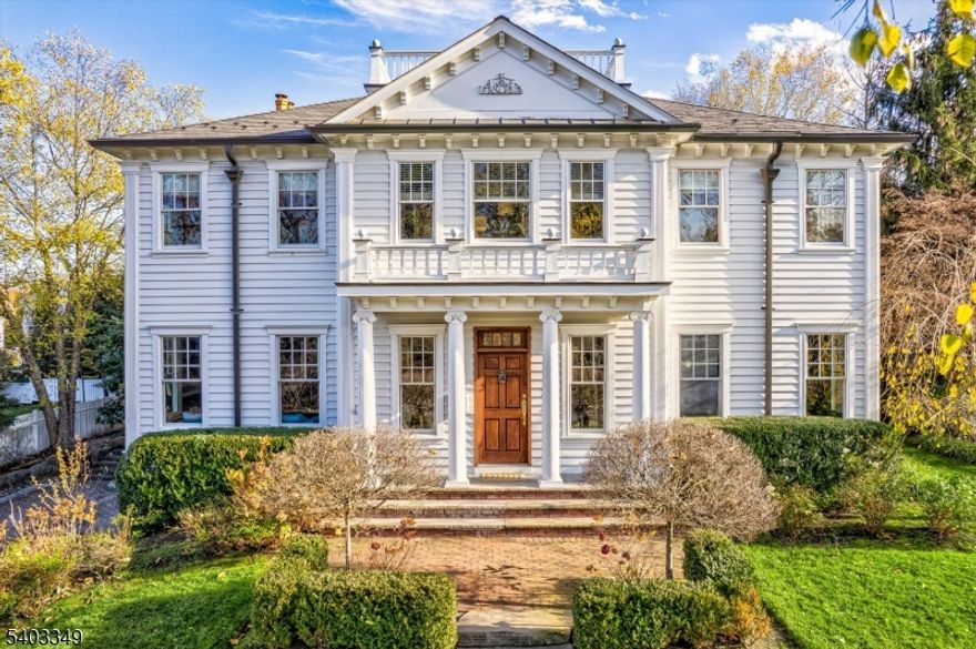 Welcome to this impeccably designed home nestled in Madison's highly desirable Hill neighborhood. Exquisite millwork, high ceilings, and meticulous details throughout conveys a unique Southern charm, and an atmosphere of timeless sophistication.The seamless layout leads to the heart of the home: chef's kitchen with a generous center island, open to the family room, and a butler's pantry connecting to the banquet -sized dining room for effortless entertaining.The elegant living room showcases an impressive coffered ceiling, adding architectural depth and refined character to the space. Upstairs, six spacious bedrooms and three baths provide private living quarters. The luxurious primary suite is a true retreat, featuring a gas fireplace, a private balcony overlooking the backyard, and a custom ensuite marble bath with a steam shower, soaking tub, and dual sinks. A walk-in closet offers abundant space. Outdoors, a professionally landscaped backyard oasis awaits.  A paver patio anchors the space with an outdoor kitchen and a  wood-burning fireplace, while two covered tiered porches provide peaceful places to relax. Modern conveniences include a basement-to-kitchen dumbwaiter and a second floor laundry chute. This exceptional home offers an effortless blend of luxury and functionality in one of Madison's most sought -after neighborhoods.