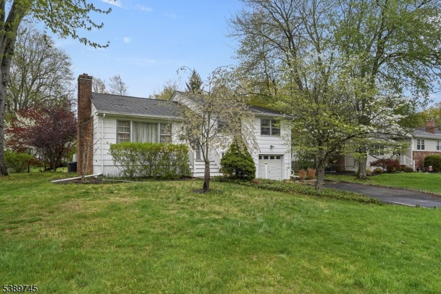 Fantastic opportunity to live in the highly desirable town of Berkeley Heights. Set on a beautiful tree-lined street, this classic split-level home offers endless potential to create your dream home on a wonderful property. Ideally located just moments from vibrant downtown shopping, top-rated schools, parks, houses of worship, and convenient transportation to NYC, this home blends location, lifestyle, and opportunity. A welcoming entry leads into a sun-filled living room and formal dining room with access to the backyard deck and patio, perfect for everyday living and entertaining. The eat-in kitchen offers great space and functionality, ready for your personal touch. The second floor features three bedrooms, one full bath, and a convenient half bath. The ground level includes a comfortable family room, while the full unfinished basement provides laundry, utilities, workshop space, and abundant storage. Additional highlights include a one-car attached garage and park like property. The private, fenced backyard with deck, patio, and pergola creates the perfect setting for relaxing or entertaining. A rare opportunity to bring your vision to life and create the home you've always imagined in a sought-after location.