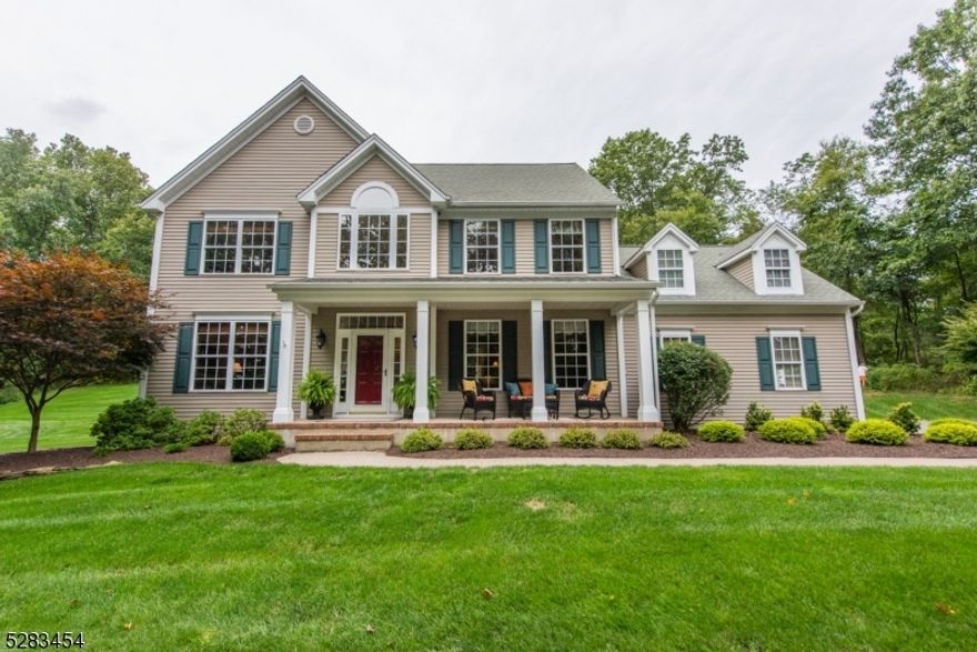 Wow!  Gorgeous center island eat-in renovated kitchen with ceiling height custom cherry cabinets, granite countertops and commercial grade appliances, including Viking 6 burner gas range with hood & warming drawer, Viking refrigerator, & radiant heated floors. Wood flooring on 1st & 2nd fl, step down family rm w/woodburning fireplace, recessed lighting & custom blinds. 2 story entry foyer staircase leads to double door entry to primary BR w/vaulted ceiling, huge walk-in closet w/laundry, under eaves storage. En suite bath features dual vanity, stall shower, jetted tub, linen closet. 3 additional spacious BRs and updated full bath complete the 2nd floor.  Finished basement wi/ample storage, professional landscape in private setting, storage shed, generator hookup, and NEW roof 2021 complete this perfect home.  Property backs to Woodpecker Point Preserve (Land Trust)