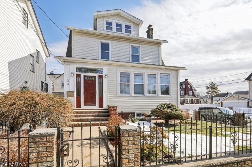 Welcome home to a beautifully maintained property that blends classic charm with modern comfort. Hardwood floors flow throughout, complemented by a striking stained-glass window that adds warmth and character. Step into the inviting living room, where a cozy fireplace sets the tone, and enjoy the convenience of a den to the right, ideal for a home office, reading nook, or TV room. Hosting holiday gatherings is effortless with a formal dining room. The spacious kitchen is perfect for both cooking and entertaining, featuring a center island, recessed lighting, and included appliances. Major systems have been thoughtfully updated within the last five years, including the furnace, water heater, and roof, providing peace of mind for years ahead. Central air and ceiling fans ensure year-round comfort, while the partially finished basement expands your living space and includes a full bathroom. With four bedrooms, a two-car off-street parking deck, and a Vivint security system already installed, this home offers convenience and comfort. A truly move-in-ready gem filled with desirable features.