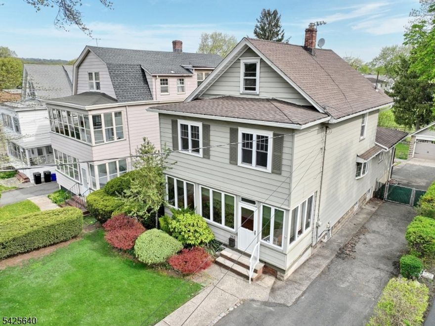 Welcome to this charming side hall Colonial nestled in the heart of Bloomfield, offering the perfect blend of classic character and everyday functionality. The first floor features a sunny enclosed front porch, a formal living room, and a formal dining room ideal for entertaining. A comfortable family room provides the perfect space to relax or host guests, while the nicely sized kitchen offers ample room for cooking. A full bath with a stall shower completes the main level. Upstairs, you'll find three bedrooms and a full bathroom with a tub. A walk-up attic provides additional storage, and a full unfinished basement with a laundry area adds even more practicality. Outside, enjoy a two-car garage and a deck overlooking the yard, which backs directly to Pulaski Park for added privacy and scenic views. Conveniently located near NYC transportation and a vibrant downtown, this home offers both comfort and accessibility in a desirable location.