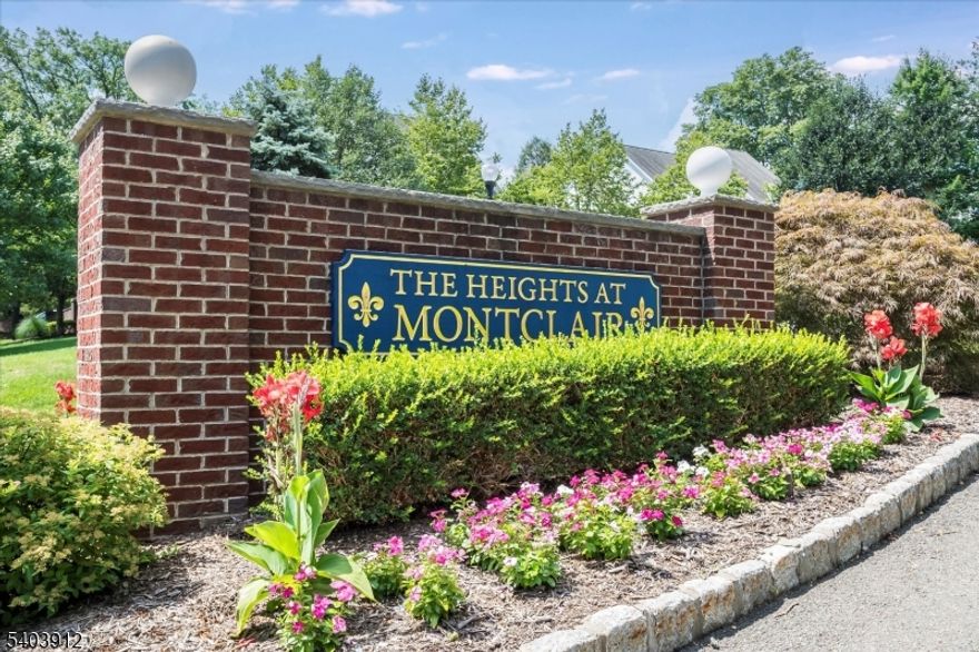 Rare opportunity to own in The Heights at Montclair, a coveted 19-unit community offering the perfect blend of privacy, space, and convenience. This townhouse lives like a single-family home with a stylish, turnkey interior and fabulous flow. The dramatic double-height foyer welcomes you into a sun-drenched open floor plan with soaring ceilings and updated finishes throughout. The newly renovated chef's kitchen boasts custom inset cabinetry, granite countertops, large center island, Thermador 6-burner range and refrigerator, dry bar/butler's pantry, and a charming built-in window seat. Kitchen opens to the great room with gas fireplace and access to a private fenced paver patio. Upstairs are three generous bedrooms, including a luxe primary suite with cathedral ceilings, sitting area, walk-in closet, and stunning new bath with soaking tub, water closet, and double vanity. Jack and Jill bath also fully renovated. Huge second-floor laundry room. Finished basement features high ceilings, rec/play area, separate office/den, full bath, and tons of storage. Two-car attached garage, new hot water heater, and ample custom closets throughout. Just minutes to NYC trains and the heart of downtown Montclair, this stylish, spacious stunner delivers the total package you've been looking for! A Must-see!