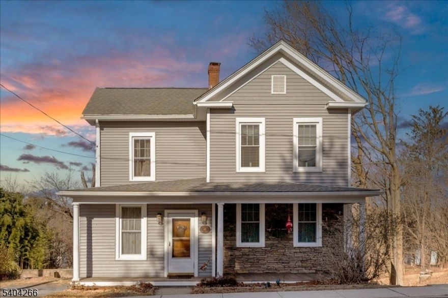 Colonial-style home in Hampton offering a blend of classic charm and modern comfort. This residence dating to the 1800s is situated on a nice-sized lot and features two bedrooms and two bathrooms, providing a warm and inviting layout with flexible living space.The main living and dining areas flow effortlessly into a large, eat-in kitchen with an abundance of cabinets, perfect for both everyday living and entertaining. The property boasts much of its original wood features, including beautiful flooring and millwork, preserving its timeless character and craftsmanship. Additional features include a walk-up attic providing ample storage.Outside, the property is complemented by a welcoming front porch, a covered back deck, and a large backyard inviting relaxation and outdoor enjoyment.