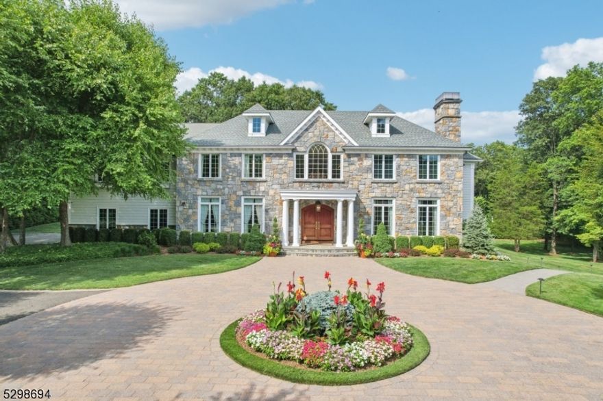 Discover luxury living at its best from this first time offered, elegant 6 BR, 6.5 bath colonial custom built by renowned builder John Avanzato on the street nominated most prettiest in Bergen County. Nestled on 2.5 picturesque acres, this magnificent home was completely updated in recent years.  Every part of this meticulous home was professionally designed to bring the outside in & capture all of the surrounding natures beauty. The 1st floor features a designer kitchen w/top tier applicants, a light filled breakfast room, LR/FPL, FDR, Great RM/FPL, FR/FPL, BR/Office, bathroom & powder room. The 2nd floor has a luxurious primary bedroom with new spa like bath, 4 additional bedrooms, 3 newly updated bathrooms & laundry. Finished lower level features a home theatre, a full kitchen, Rec RM, play RM, Gym, BR, Bath & a 2nd lndry. The beautiful grounds are complimented by bountiful gardens, a salt water pool, fountains and an all season covered & heated porch w/ built in outdoor BBQ