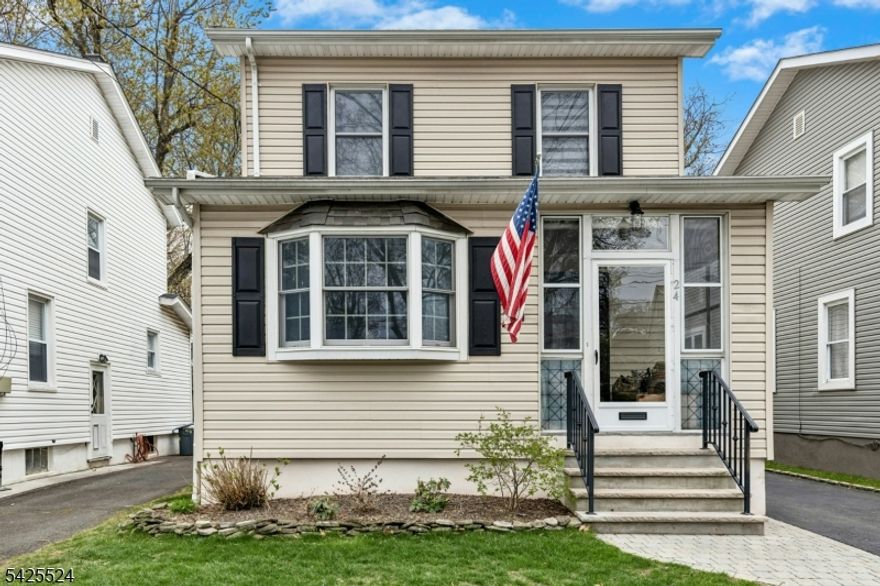 This classic Colonial is much larger than it appears and beautifully updated throughout! A charming enclosed front porch welcomes you into a spacious and versatile first floor featuring a sun-drenched office with walls of windows, formal living room, and a large dining room perfect for entertaining. The stunning, newly renovated kitchen is truly the heart of the home, showcasing custom cabinetry, quartz countertops, wall oven, and high-end appliances, all opening seamlessly to the family room with views of the private rear yard. A beautiful powder room completes the main level. Upstairs offers four generously sized bedrooms, including a gorgeous primary retreat with high ceilings, a spa-like bath, and an oversized walk-in closet. An updated hall bath completes the second floor. The finished basement provides flexible bonus space ideal for a family room, playroom, gym, or home office. Step outside to enjoy a deck and patio designed for entertaining, plus plenty of grassy yard space. With updated HVAC, kitchen, baths, fresh paint, and abundant storage, this home is truly move-in ready. Ideally located just blocks to schools, pool and parks, and only one mile to Cranford's vibrant downtown, restaurants, and train  - this is the perfect blend of space, style, and convenience!