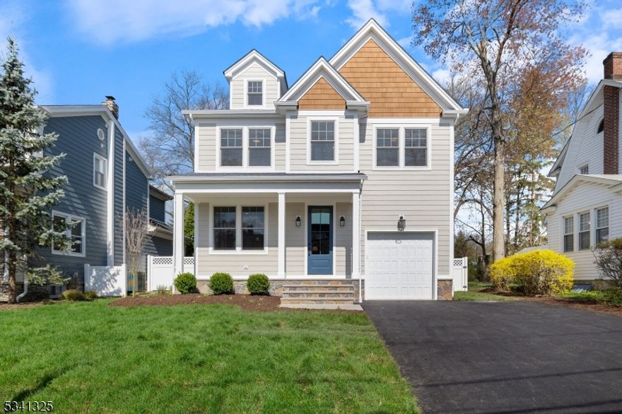 Welcome to 113 Pearl St. Westfield ! A sophisticated sanctuary designed for modern living. The front porch and open-concept living/dining area create an airy and inviting atmosphere. High ceilings and exquisite architectural details add a touch of timeless elegance, while the thoughtful layout ensures effortless flow between spaces. The heart of the home is the kitchen, a culinary masterpiece, featuring a stunning center island. Top-of-the-line appliances, walk in pantry and the butler's pantry/bar area is ideal for effortless entertaining. The sun-drenched family room, with its inviting fireplace and four-panel sliding glass door to a private, fenced yard/patio, provides a seamless transition between indoor and outdoor living. Upstairs, four generously sized bedrooms await, including a luxurious primary suite that's a true retreat. The walk-in closets offers ample storage, and the ensuite bathroom is designed for convenience and relaxation. A 2nd full bathroom, convenient laundry room and the additional bedroom ensuite is  located on this level. The 3rd floor is boasting a versatile loft area for a home office,  library, fitness, or a playful space. The finished basement adds a layer of versatility w/a grand 35x15 recreation room " perfect for a home theatre, game room, or extra living area w/ another 1/2 bath.This home is an embodiment of modern luxury, eco-conscious design, and unparalleled functionality.