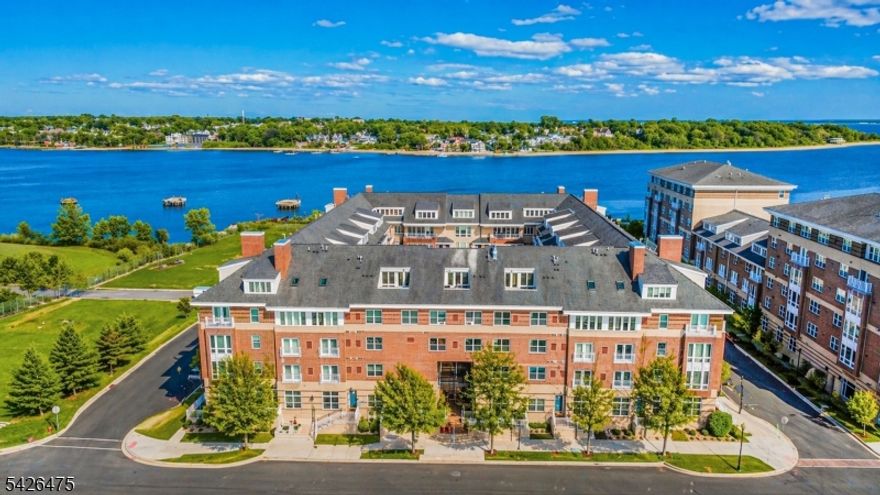 Welcome to elevated waterfront living in the heart of Perth Amboy's "The Bayview''. This fully renovated 2-bedroom, 2-bathroom residence at 368 Rector Street, Unit 307 is the definition of turnkey luxury where every detail has been thoughtfully designed and flawlessly executed.  Step inside to a sun-drenched, open-concept kitchen, living & dining layout enhanced by new flooring, crown moldings, and elegant recessed lighting that creates a modern ambiance. The completely redesigned kitchen is a true showpiece - featuring sleek cabinetry, pantry space, island storage, premium GE Cafe appliances, and refined finishes that blend style with functionality.  Throughout the space one will find surround sound speakers, remote controlled window treatments and light fixtures sure to impress. The king-sized primary suite offers a private retreat with its own beautifully updated en-suite bath, double closets and private balcony providing waterfront views. The second queen-sized bedroom provides flexibility for guests, a home office, or both. The guest bathroom has also been completely remodeled with luxurious finishes.   What truly sets this home apart is its seamless indoor-outdoor living. New HVAC, Nest thermostat, water tank and in-unit washer/dryer provide complete peace of mind. This wonderful community offers state of the art security system, courtyard, elevator, exterior maintenance, fitness club and garage parking for a nominal maintenance fee of $401.57/mo.