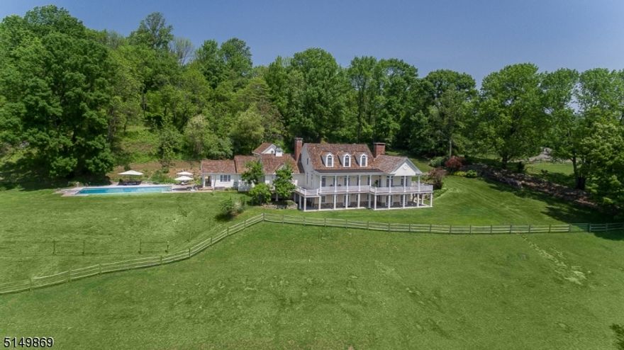 One of a kind elegant retreat-like horse farm w/magnificent views in secluded private rd setting, 1-hr from NYC. 1st floor primary suite, in-law suite, multiple home offices, in-ground gunite pool/spa overlooking pastures of farmland. Income producing 2BR rental cottage, 8-stall barn, indoor and outdoor arenas. Pastoral & expansive views overlook hundreds of preserved land acres. Additional highlights include hardwood floors, oversized windows, sauna, steam, walk-out ground level w/2 full baths, veranda w/breathtaking views, cobblestone courtyard for entry to main house & garages, in-ground pool/spa, 7 garage spaces, greenhouse, fenced pastures/hayfield, restored historic barn. Separate home offices or in-law suite. Grounds include gardens, fruit orchard, fishpond, stone walls, walking trails.  Residences & farm feature thoughtful siting & finishes for rare blend of privacy, elegance, warmth & functionality. 33 acres, natural gas. Convenient location provides all sophisticated country living offers just outside of the charming village of Oldwick, yet minutes from Rt. 78. Shopping and dining nearby.