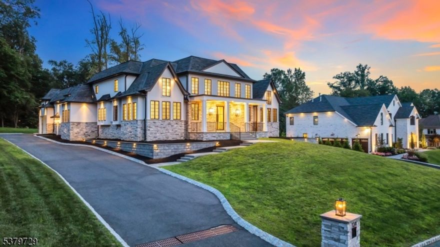 North Caldwell's Future Landmark - Presented by Christie's International Real Estate, this modern chateau stands poised to set a new standard in town. Perched on a coveted hilltop, its commanding black-and-white facade, sculptural rooflines, and impeccable symmetry evoke both European grandeur and cutting-edge design. Created by Liggero Architecture and crafted with only the finest materials, the home is a study in refined drama. Through double iron-and-glass doors, soaring ceilings and walls of glass frame sweeping western views. The great room, anchored by a sleek fireplace and statement bar, flows effortlessly into a chef's kitchen where Shiloh cabinetry, thick-edge granite, and Wolf & Sub-Zero appliances create a space both functional and showstopping. A butler's pantry and hidden scullery cater to grand entertaining. The main-level primary suite is a private retreat with vaulted ceilings, two Italian-built closets, and a spa-inspired bath with White Volcanic Stone tub, walk-in shower, and private patio with fireplace. Upstairs, generous bedroom suites offer balconies, vaulted ceilings, and even hidden rooms. The 3,500 sq. ft. lower level is primed for a theater, game lounge, luxury bar, or au pair suite. With approved plans for a resort-style pool and outdoor kitchen, plus a 900 sq. ft., 3-car garage with lift-ready ceilings, this property offers both prestige and possibility. An address of distinction designed for those who expect nothing less than extraordinary.