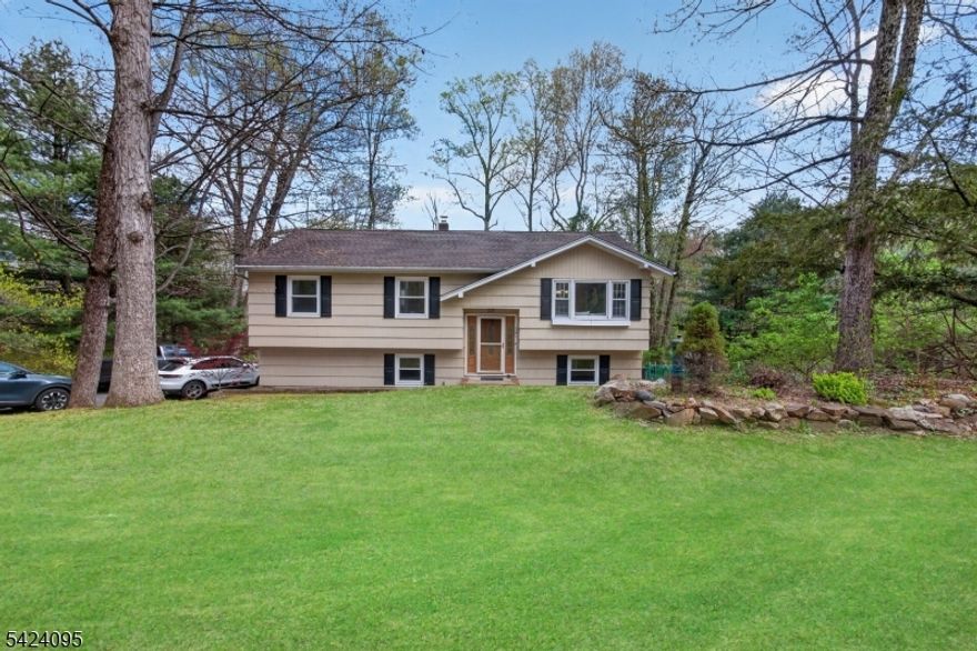 Charming Newly Renovated Bright Lovely 3BR 2BA Idyllic Home Close to Everything & Surrounded by Nature.                                                                                                     Enter the two-story foyer and take a few steps, your view focuses on the warm inviting living room filled with natural light. Enjoy sweeping views of the back lawn and surrounding woods below from the large dining room and open modern kitchen featuring stainless steel appliances, granite countertops, full size island with breakfast bar. A spacious bright primary bedroom, gorgeous full bath along with two other bright bedrooms complete the upper level. Lower level offers a large family room, with sliding door access to the large patio and serene backyard, office/bonus room also with access to the backyard, laundry room, and 1 car attached garage. Plenty of parking is available in the driveway. Conveniently located near shopping, restaurants, hospitals, and major highways.                                                                                                                                                                                                                                 NOTE: Home is in MOUNTAIN LAKES HIGH SCHOOL district.
