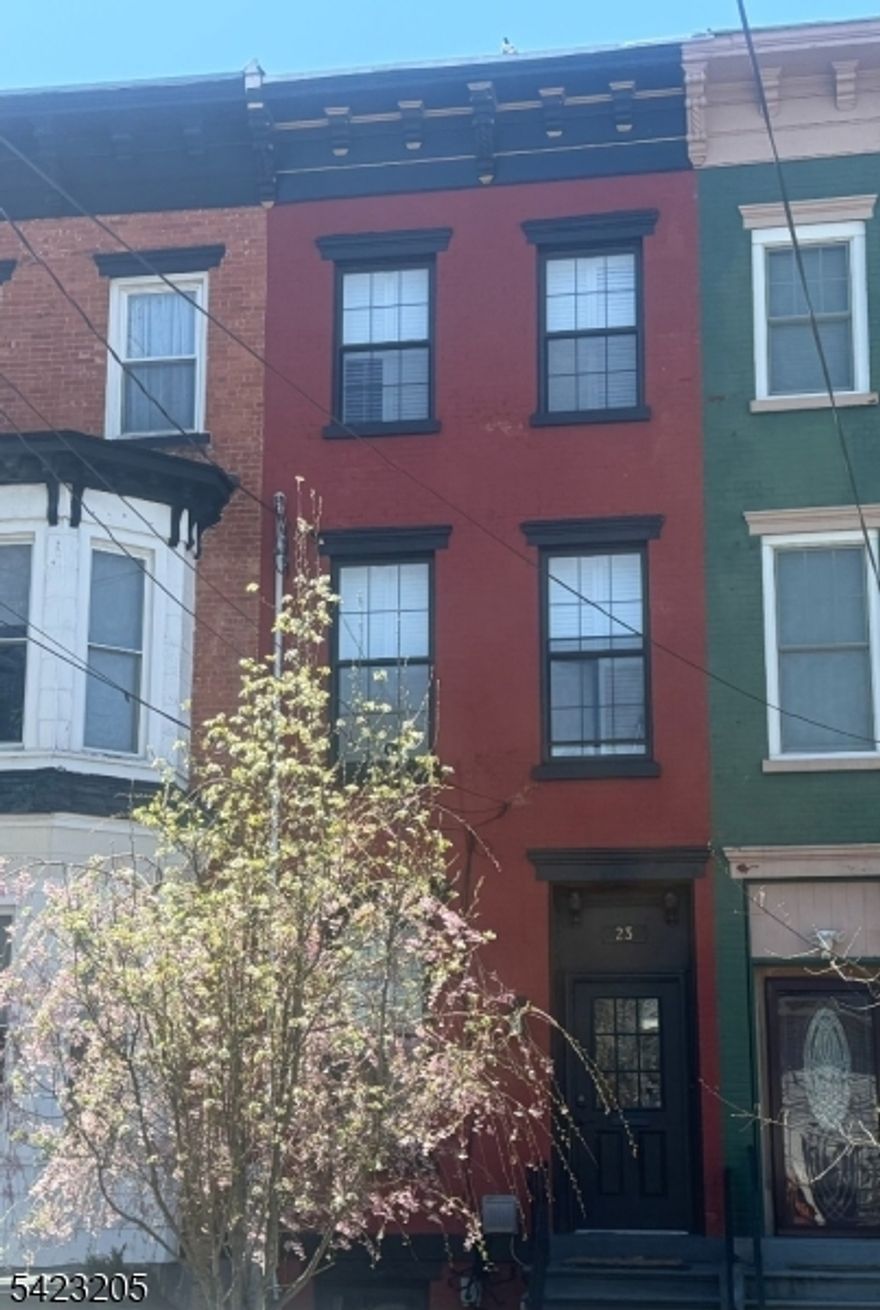 Welcome to this beautifully renovated brick townhouse in the heart of Jersey City's historic Bergen Hill an area known for its rare "suburb in the city charm and historic homes. Ideally located within one mile of the PATH and just over a half mile from the Light Rail, this home offers both tranquility and exceptional connectivity.Spanning four expansive levels, this updated residence (fully renovated in 2018) features 5 spacious bedrooms and 3 full bathrooms, providing flexible living for a variety of lifestyles. The waterproofed basement adds valuable bonus space perfect for a rec room, home office, extra storage, or a gym. The main living areas are designed for both comfort and entertaining, anchored by a modern, updated kitchen with contemporary finishes. Step outside to a backyard deck that overlooks a beautifully manicured outdoor space, professionally designed and serviced by A Small Green Space. The yard is enhanced with self-watering landscaping making outdoor living both effortless and enjoyable.In addition to the flourishing public schools in the area, this home is located approximately half a mile (or in most cases, two blocks!) from several of Jersey City's most sought-after early education options, including Bergen-Lafayette Montessori School, Learning community Charter School (LccS), Play & Learn School, Primary Prep, St. Elizabeth School, and more offering exceptional educational access right at your doorstep.