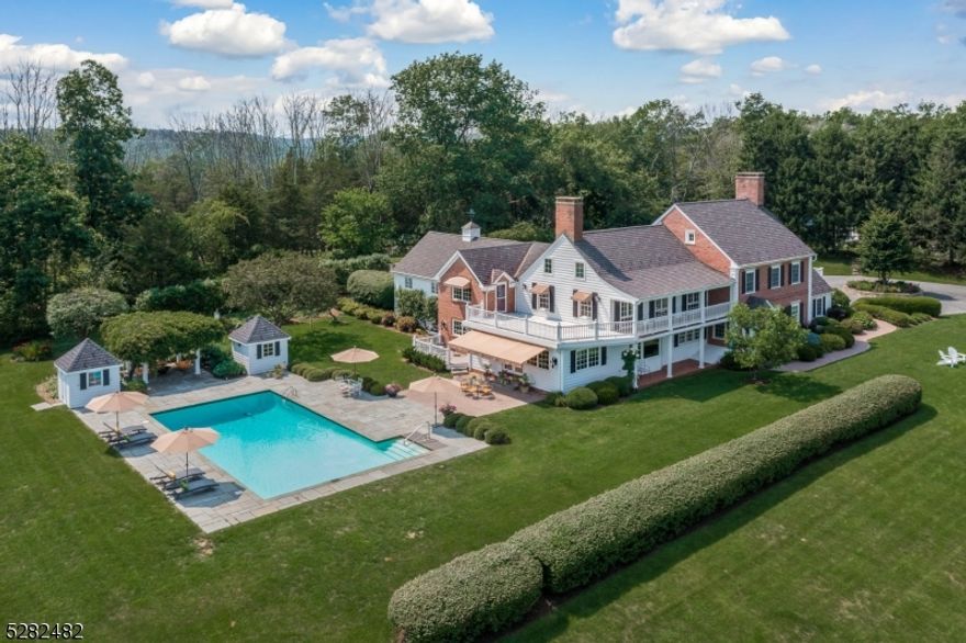 Time-honored country living is the hallmark of this new offering, on one of Bedminster's rarely available and most desirable lanes. Spectacular views from every corner are the standout feature of the magnificent estate, elevated above the neighboring landscape in the heart of NJ's renowned hunt country. The completely renovated, custom home enjoys over 17.6 rolling acres of pastoral land and handsome gardens. Tree-lined and deer-fenced borders give the exceptional residence and incomparable lot tranquility and an abundance of privacy. Replete with recreational opportunities (and farm-assessed), the property is an outdoor oasis. A fenced Har-Tru tennis court, a fenced vegetable garden with potting shed, as well as a 50' X 25' heated gunite pool with bluestone surround, cabana, and adjacent wisteria-covered gazebo enrich these magnificent grounds. Garden sculptures by artist Lyman Whitaker, fruit trees and specimen trees weave together an artful and natural aesthetic. Perfectly placed in the heart of it all. Extensive true divided-light windows, patios, porches and terraces surround the impressive estate, affording daylight, moonlight and unmatched starlight. With Bedminster serving as backdrop, this sensational home enjoys easy proximity to NJ's top schools, the mountains, beach, EWR and NYC, truly the best of all worlds.