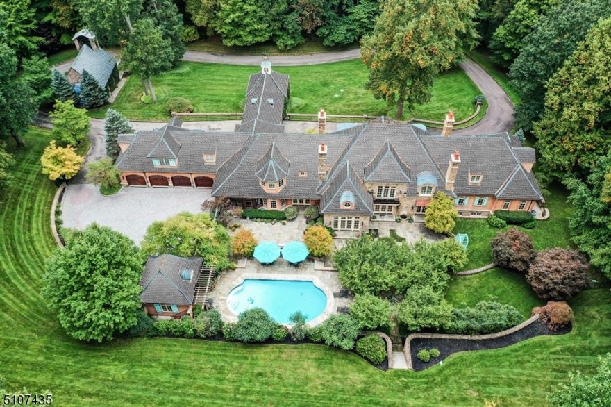 This French country masterpiece is ideally located on 9.15 acres at end of private lane, for ideal privacy & location, w/ spectacular pool & pool house, workshop/guest house & irreplaceable chapel built in 1908. Built w/incredible detail after trips to France, residence offers high ceilings, massive wainscoting & moldings, plaster ceilings & walls, 150 year old reclaimed pine floors, radiant heated Spanish Sienna marble flrs, antique fixtures & FP mantles & custom aged copper gutters & downspout boxes. Gourmet eat-in kitchen features French antique cupboard built into kitchen cabinets, Sienna tumbled marble floor w/ radiant heat, refrigerator/freezer w/ custom painted surround, large multi-leveled island, built-in butcher block, domed ceiling w/ 3 custom/commercial kitchen lights, Garland 6 burner/double oven, & Farmers sink. 1st level w/piano bar off foyer, family rm w/2-story vaulted ceiling & Sandblasted Stone FP surround w/mantle, dining room w/limestone FP, reading rm, office, laundry rm & primary suite w/ sitting rm, WIC & spa-like bath. 5 en suite bedrooms on 2nd level including a 2nd Primary Suite. Caretaker's Apart w/ kitchen & living rm. Lower level w/office, 11 seat theater, gym, rec room w/8 seat bar & pool table area, massage/steam room & 1000 bottle wine cellar. Owner won tax appeal; taxes have been reduced by over $10,000 per year. Owner installed new lifetime warranty Da Vinci slate/composite slate roof 12/22. Renovated pool & Upper Bluestone patio 9/22.