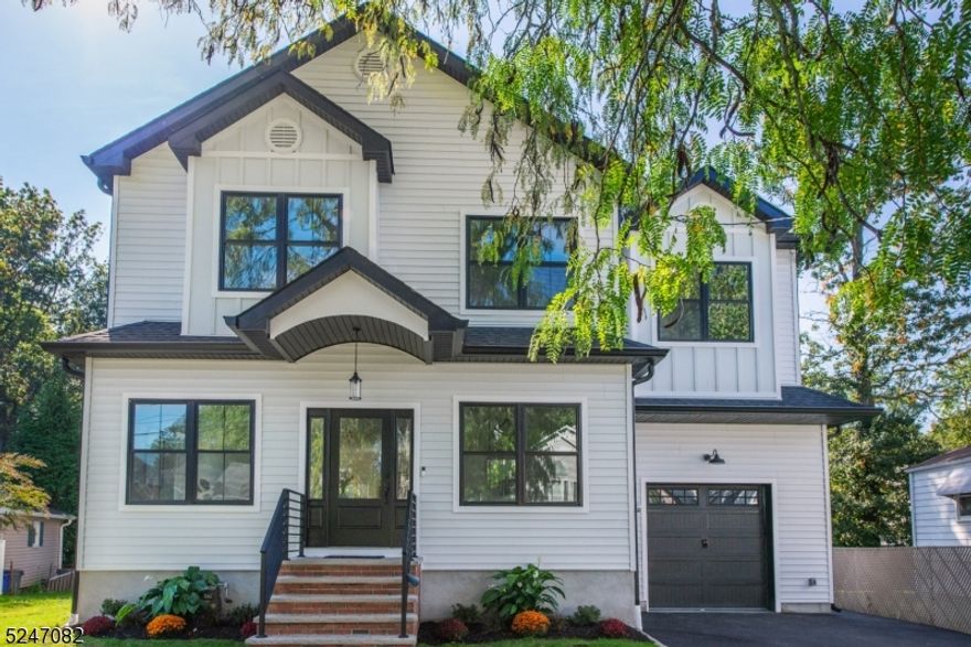 Be the FIRST to live in this NEWLY BUILT Luxurious 5-bedroom colonial on one of Kenilworth's most desirable streets! Top-quality materials meticulously designed & installed w. exceptional craftsmanship, curated by TOP NJ Builders. As you step inside, you're greeted by the radiant beauty of solid oak hardwood floors, an open floor plan, & opulent finishes throughout. Abundant natural light fills the space, & 9-foot ceilings on both the 1st & 2nd floors adds to the grand, open, inviting, atmosphere. The dining room will impress all of your holiday guests with custom millwork. The heart of this home, the chef's kitchen, leaves nothing to be desired.  Adorned w. soft-close cabinets, quartz countertops, top-tier GE stainless steel appliances, & an expansive center island complete w. a breakfast bar. Oversized pantry is perfect for bulk needs. Convenient mudroom off the 1 car attached garage is perfect for organizing. The first floor has a full bath & a potential first-floor bedroom or office. On the 2nd floor, master suite unveils itself as a serene oasis w. beautiful accent trim & tray ceiling. The marble-clad spa bath invites relaxation w. soaking tub & a rainfall shower. You will love the walk-in master closet/dressing room. Large guest bedrooms & functional guest bath appease all. Convenient 2nd floor laundry room. Fully finished basement features a full bath, expanding the possibilities for entertainment & relaxation. Great size yard, incredible location, & fantastic price!