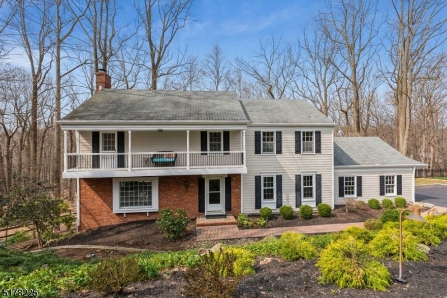 Stylish serenity in a private setting! Spacious and modern Colonial situated on a landscaped lot at the end of a quiet cul-de-sac in one of the most sough-after neighborhoods in Morris Twp. This home is just minutes away to a lively downtown with to shops, restaurants, MPAC, Routes 287, 202 and Midtown direct Train to New York City.  With gorgeous hardwood floors, chair and crown moldings, large windows letting in lots of natural light and an updated kitchen, this beautiful home is ideal for entertainment in style. Welcoming spacious foyer invites you to a large living room with a brick suround wood burning fireplace and an adjacent formal dining room. The updated eat-in kitchen features Quartz counters and backsplash, SS appliances, pantry, bright cabinetry with a large center island with seating. Off the kitchen is a convenient first floor office with a custom built floor-to-ceiling shelving and the laundry room with access to the deck overlooking the private backyard and woods beyond. The second floor includes a spacious primary suite, updated en suite bathroom, walk-in closet, and dressing area.  Three large additional bedrooms, one with a charming balcony, and an updated hall bathroom. The fully finished walkout basement to backyard patio offers a fantastic space for entertaining with a wet bar, powder room, workshop and plenty of storage. This distinctive home offers a harmonious balance of a tranquil .77 acre property backing to Township parkland.