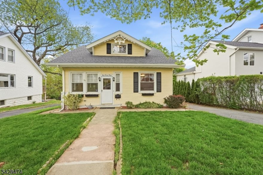 An extraordinary opportunity to own a charming, gingerbread-trimmed and well-maintained 3-bedroom family home located in a quiet, tree-lined neighborhood in Nutley.The enclosed  front porch invites you into the home and opens to a light-filled living and dining room featuring original maple hardwood floors, classic trim, six-panel doors, oversized windows and timeless character. The first-floor flows into a family room with warm wood wainscotting and a fireplace, a bedroom turned office with closet and full bath. The efficiently laid-out, updated eat-in kitchen opens to an oversized deck overlooking the pool and backyard. The 2nd floor features two generously sized bedrooms with deep closets and another full bath. Off the primary bedroom is a cozy office or reading nook. The basement has access to the backyard and features the laundry area, a 20' workbench for DIYers, and an old-fashioned canned jam storage closet. Updated utilities include central air conditioning.The above-ground pool sparkles with a new liner and is surrounded by Azek decking that leads to a stone paver patio with seating around a firepit, a BBQ area and a view of the large, level backyard that features terraced gardens and a fenced-in yard at the property line. The one car garage has lots of storage space, and the driveway fits 2-3 cars.Ideally located near shops, restaurants, major highways, an elementary school and local parks. Bring your vision to make this your new home. Home is being sold as-is.