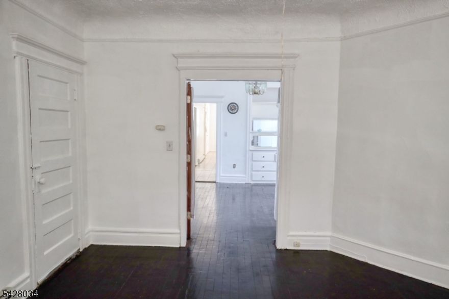 Spacious and income-producing multi-family opportunity. This well-sized property features approximately 2,500 square feet of living space, offering a total of 6 bedrooms and 2 full bathrooms across an elongated layout designed for functionality and comfort. Each unit includes, eat-in kitchens, and generous pantry space. It is ideal for both owner-occupants and tenants alike offers ample storage with a full unfinished basement. Outside, enjoy a fenced-in driveway along with a 2-car garage and additional parking, a valuable feature for multi-family living. The home sits on a residential block with convenient access to major highways, public transportation, shopping, and everyday essentials.