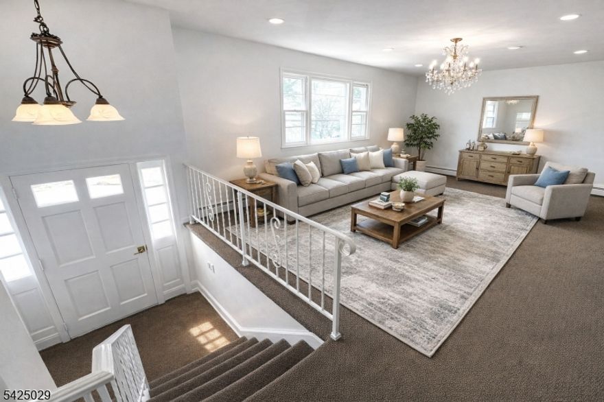 Fantastic well maintained raised ranch set on an oversized lot, with over 2000 sq ft of living area and located in a quiet residential neighborhood with convenient access to Route 46, the Garden State Parkway, public transportation, local parks, and downtown Garfield's shopping and dining options. This property offers rare off-street parking for up to four vehicles, a valuable feature in this area. The main level features a bright and functional layout with a spacious living and dining area, an eat in kitchen, three bedrooms, a full bathroom. The ground level provides additional finished living space along with a large laundry and utility room, offering flexibility for a variety of uses including recreation, workspace, or additional living area. Among the key features you might overlook are the tankless gas heating and hot water system and 200 amp electrical service, providing efficiency and modern infrastructure. Step outside to enjoy a private gated backyard complete with two storage sheds, ideal for tools, equipment, and additional storage. With its generous lot size, flexible layout, valuable upgrades, and convenient Garfield location, this property presents a unique opportunity in today's market.