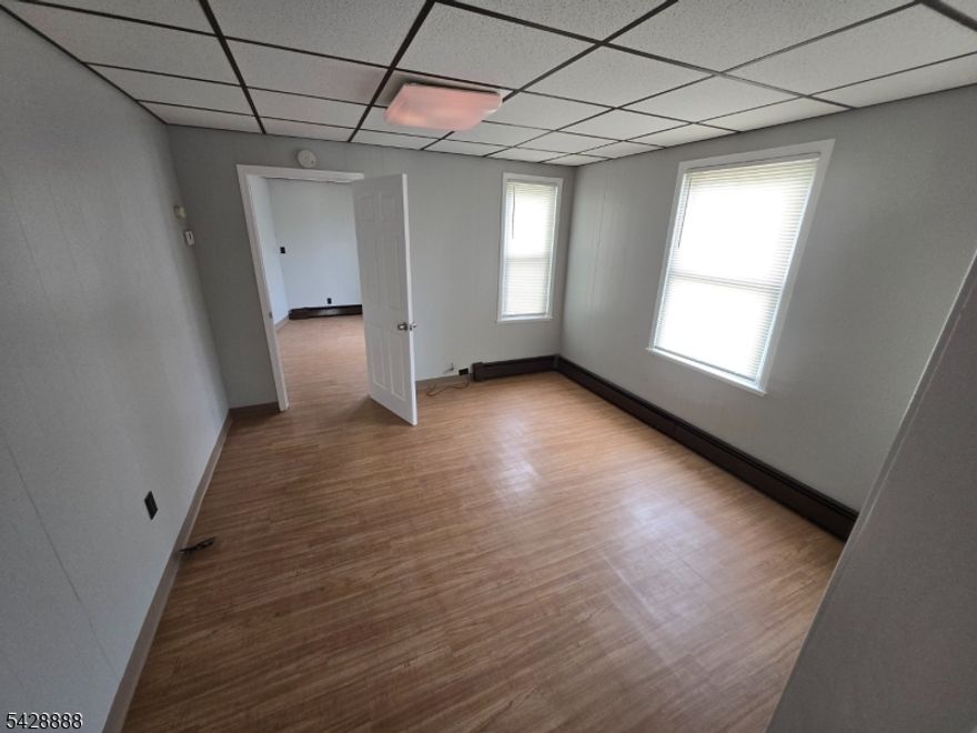 First floor 1 bedroom, 1 bath apartment in a convenient Piscataway location. Vacant and move in ready, this well maintained unit features an updated kitchen with newer countertops and a functional layout. Rent includes heat, water, sewer, trash removal, lawn maintenance, snow removal, and broker fee paid by landlord. Tenant enjoys access to shared enclosed front porch, common yard, and basement with coin operated washer and dryer plus a private storage locker included. Off street parking for two cars. Located just blocks from shopping, dining, library, and everyday conveniences with easy access to major roadways.Tenant responsible for gas for hot water and stove, electric, renter's insurance, and cable or TV. No pets and no smoking permitted. Application, credit, and background check required.