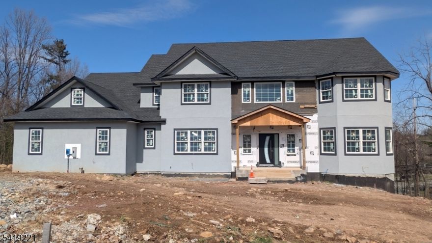 Opportunity to own a partially completed 7 Bedrooms and 5 Baths colonial 4100 sq. ft home in a desirable Denville location on the mountain with prestigious million plus dollar homes. This property is being sold  " As Is "offering a unique chance for investors, builders, or end-users to finish the project to their own taste  and specifications. FULLY FINISHED WALKOUT BASEMENT. HARDWOOD FLOORS. GAS FIREPLACE. TREX DECK. CENTRAL AIR AND HEAT. Major work has already been done, saving time and initial costs. Ideal for those looking to customize their dream home or add value through completion. Conveniently located near major highways, shopping, dining, and top-rated schools. Buyer responsible for all remaining permits, inspections, and construction.