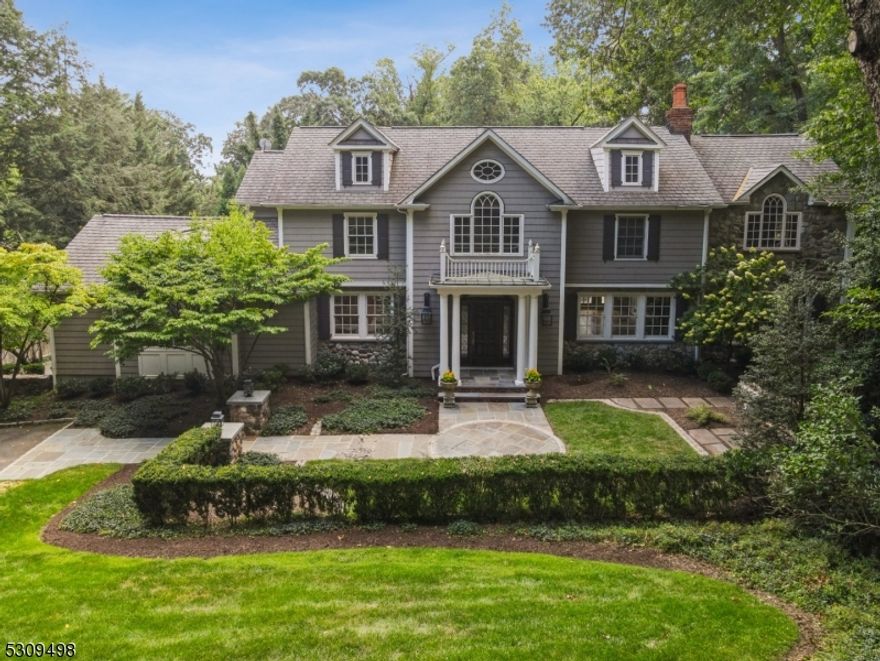 This spectacular grand colonial was completely rebuilt, renovated & expanded with the highest attention to detail and quality, & is ideally located on a idyllic 0.6 acre lot on one of the most prestigious streets in Short Hills, walking distance to Hartshorn Elementary School (0.6 miles) & train station (0.9 miles). Featuring 6 bedrooms, 7 full & 2 half baths, a 3 car garage, stunning pool, spa & pool house w/powder room & kitchette, on .6 acre of park-like property, this incredible estate is the dream home you've been waiting for! Stunning 2-story grand entrance hall, formal front-to-back living room open to wood paneled office/library w/ 2-sided wood burning FP, & large dining room, perfect for entertaining. The stunning gourmet eat-in custom kitchen has large center island, pantry, informal dining area, sitting area & attached family room, ideal for large gatherings. Entertaining areas have 4 sets of double French doors leading to cedar deck overlooking sweeping lawns & stunning pool w/raised spa & pool house, surrounded by mature evergreens for great privacy.1st level in-law suite & full bath. 2nd level features large primary bedroom w/gas fireplace, seating area, large architectural windows, 2 custom WICs, & spa-like bath w/ jacuzzi & shower. 3 additional en suite bedrooms complete the 2nd level. Lower level features a rec room, exercise room, game room, 2 full baths, summer kitchen, cedar closet, potential wine cellar, & bonus room/bedroom w/ full bath & walkout access.