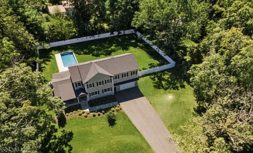 NEW CONSTRUCTION, masterful design & modern luxury are blended gorgeously in this MOVE IN READY Custom Colonial located in tranquil Millington NJ. Ideally located near shops, farmers' markets, amazing rests, schools & golf courses, all in a park-like neighborhood w/easy access to Rt 287, I-78 & minutes to NJ Train for easy commute to NYC. Highlights of this home features a floor plan that combines contemporary openness w/functional spaces for a sturdy, elegant & energy-efficient home. Luxury finishes w/custom molding & trim, NEW Anderson Windows & striking red oak flooring throughout. The vaulted ceiling & large windows in the great room make this open, airy space ideal for entertaining. The gourmet chef's kitchen boasts high-end appliances, quartz counters & white cabinetry. Sliding glass doors in the sun-filled dining room open to a stone patio overlooking the private completely fenced backyard w/an in-ground SALTWATER POOL+an underwater lounging ledge. A dedicated office, powder room & well-designed mudroom w/access to the oversized garage complete this level. Upstairs the spacious primary suite w/a palatial en-suite bathroom & 2 sizable & very well-organized walk-in closets. 3 additional bedrooms, each w/walk-in closets & full baths & a convenient laundry room. The finished basement offers a spacious rec-room & additional storage. As if this house was not impressive enough, some extras include a Whole-House Generator, a Smart Patio Pergola & topline Napco Sec System.