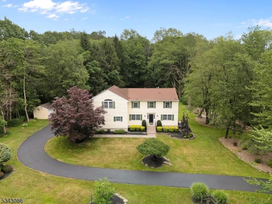 Welcome to this beautifully updated Colonial, a perfect blend of classic elegance and modern convenience, nestled on beautiful, level and usable 3+ acre lot. This home features an automatic gas generator, ensuring peace of mind during power outages. Step inside to discover a spacious formal living room bathed in natural light, perfect for entertaining guests. The dining room boasts built-in cabinets and a striking granite countertop, ideal for hosting dinner parties. The heart of the home is the kitchen, featuring hardwood floors and ample storage space, making meal preparation a delight. Adjacent to the kitchen, you'll find convenient access to the 2 car garage through the laundry room/mudroom, keeping everything organized. The main floor also includes an updated powder room and a cozy family room with a gas fireplace and built-ins, providing a warm and inviting atmosphere. Upstairs you'll find four spacious bedrooms, offering plenty of room for guests. The three full, updated bathrooms provide modern amenities and comfort. The partially finished basement features a recreational room, perfect for gatherings or a play area. Enjoy the low-maintenance exterior with durable vinyl siding and energy-efficient thermal pane windows. Stay comfortable year-round with baseboard hot water heat and central air conditioning. The large, level lot includes a shed for extra storage. Don't miss the chance to make this exceptional home yours!