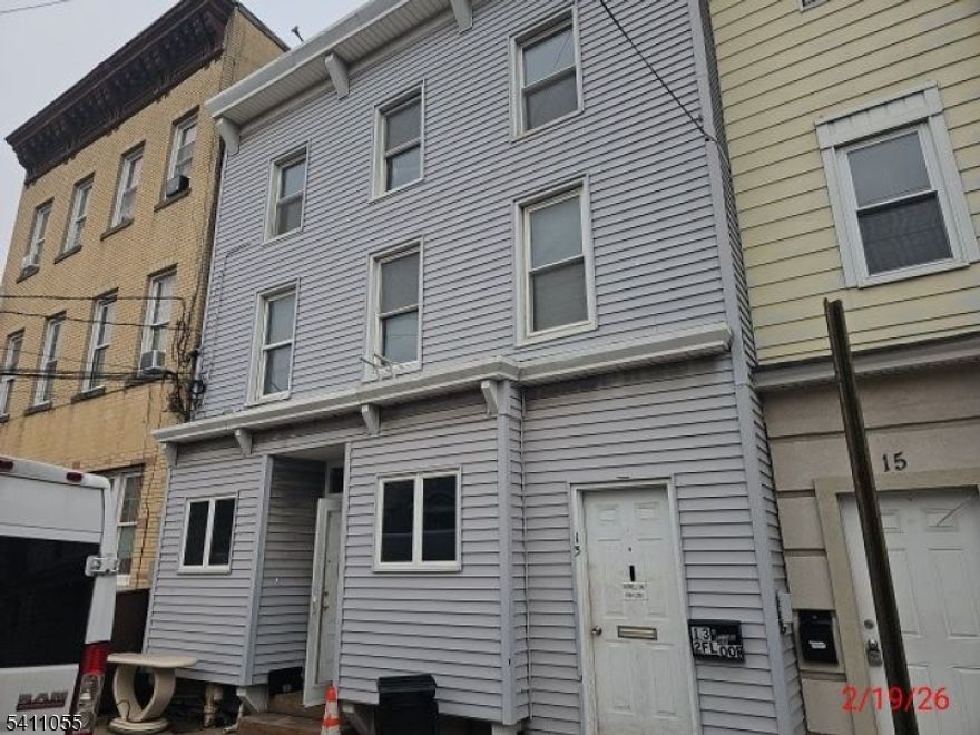 Legal 3-family investment opportunity just blocks from the 8th Street Light Rail, offering strong upside in one of Bayonne?s fastest-evolving pockets. This fully vacant property features a total of 7 bedrooms and 3 full bathrooms across three units, making it ideal for investors, owner-occupants, or those looking to maximize rental income. Each unit offers spacious layouts with great natural light, hardwood flooring, and functional living space. Select updates include refreshed interiors and an updated kitchen with modern cabinetry, countertops, and tile backsplash. Separate entrances and a classic multi-family layout provide flexibility for leasing and long-term hold strategies. The property also includes a private backyard, adding value for tenants and enhancing overall appeal. Positioned near the 8th Street Light Rail for easy access to Jersey City and NYC, the location is further strengthened by the nearby development of 1888 Studios, a major film production campus expected to bring significant job growth, infrastructure investment, and increased housing demand to the area. While the property requires some TLC, it is priced accordingly and presents a compelling value-add opportunity with strong long-term potential.Buyer responsible for all inspections and municipal requirements, including C/O. Property sold strictly as-is.