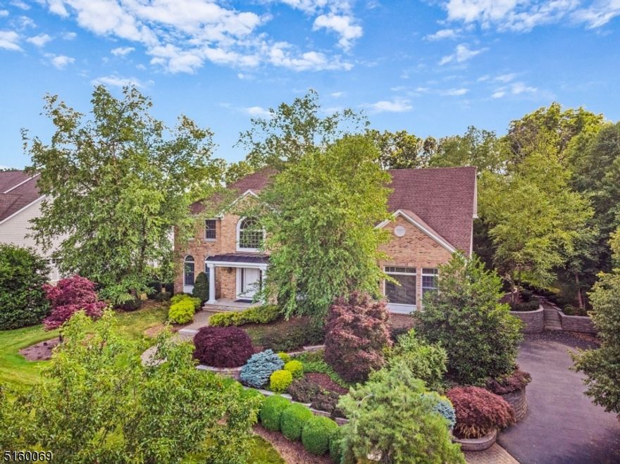 Stunning curb appeal is just the beginning of this exquisite offering of 11 Loveys Drive.  A shade under an acre of magnificent property surrounds this stately residence.   Grand two story entrance way welcomes you into the open floor plan that is ideal for entertaining and gracious living. Note all of the top superior craftsmanship & use of quality materials  throughout. The first level offers many living and entertainment spaces including a bonus room, guest en-suite and gourmet kitchen. The kitchen is contemporary yet timeless and is set apart by a generous amount of Italian white oak cabinets, high end stainless steel appliances, and complimenting Caesarstone countertops. The breakfast area overlooks and leads to a beautiful stone patio that you will never tire of as well as the privacy afforded in your picturesque rear yard. The upper level offers an expansive hall with custom cabinetry that leads to the 4 bedrooms and 2 baths including a magnificent primary suite with walk-in closets and an amazing bathroom.  Wine anyone?  Keep up to 1000 bottles in your climate controlled Wine Cellar located in the very stylish lower level that includes a built in wet bar, exercise room, office, play area, full bath & tons of storage space. Completing this home is an oversized three car gararge, whole house generator, outdoor lighting, alarm system & much more to list.  All this located in one of Florham Park's sought ofter neighborhoods.