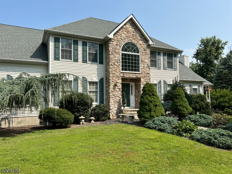 Welcome to 42 Leffler Hill Road, an exquisite 4-bedroom, 3.5-bath colonial nestled on 2.5 serene acres in Raritan Township. This elegant home boasts a grand foyer, sunlit formal living and dining room, a gourmet eat-in kitchen with granite countertops, stainless steel appliances, with sliding door to the large deck. The adjoining family room features a cozy brick fireplace, vaulted ceilings and access to an outdoor gazebo, creating the perfect space for relaxation. Upstairs, the luxurious master suite offers a walk-in closet and spa-like bath. Step outside to a spacious deck overlooking a private, manicured backyard, ideal for entertaining. With a full basement and a prime location near top schools, shopping, and dining, this home offers the perfect blend of luxury and convenience.