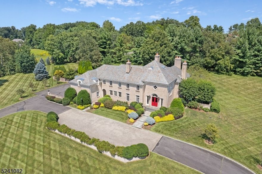 Experience the tranquility of this expansive 5-bedroom, 6 full & 3 half-bathroom retreat, nestled on approximately 4.5 acres of serene landscape. Upon entry, be greeted by the inviting ambiance of the gourmet kitchen, perfect for culinary exploration, and the elegant formal dining area, ideal for hosting memorable gatherings. Relax in the cozy living space, complete with a warming fireplace and ample natural light. The main level also boasts a sophisticated Mahogany library, convenient powder rooms, and a fully equipped laundry room. Ascend to the upper level to discover the primary suite, featuring a spa-like bathroom with a jetted tub and shower, and expansive walk-in closets. Four additional bedrooms, each with its own ensuite bathroom, offers comfort and privacy. Descend to the lower level to find a haven for entertainment, featuring a spacious recreation room, home theater, sleek wet bar, wine room, bonus room, full bath, gym, and pool showers. Outside, the meticulously landscaped backyard beckons as a tranquil oasis, boasting a sprawling patio, lush lawns, and a sparkling in-ground heated pool " the perfect setting for relaxation and outdoor entertaining. With its thoughtful design and abundant amenities, this home invites you to make it your own. Prepare to elevate your lifestyle and embrace the upcoming pool season in style and sophistication.