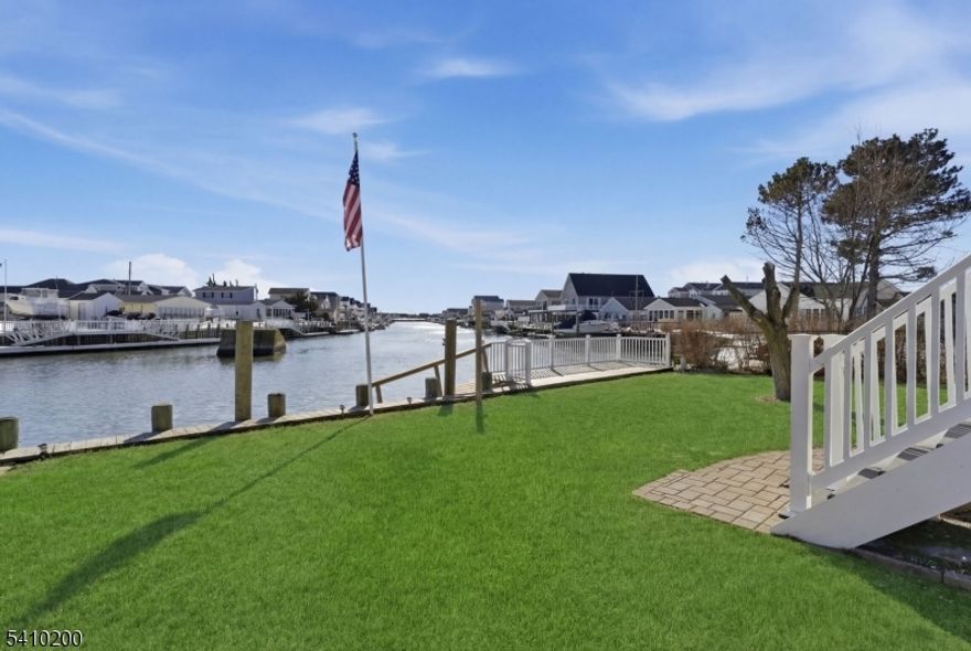 Built in 2007, this well-kept custom waterfront home offers year-round vacation living on desirable Great Bay!Enjoy stunning bay views from two expansive decks and your newer private dock perfect for boating, relaxing, and entertaining. This home features 4 bedrooms, 2 full baths, a separate dining area, and generously sized rooms throughout. Additional highlights include an attached garage, owned solar panels, and thoughtful custom details. Wake up to water views every day and experience the best of waterfront living. A must-see!