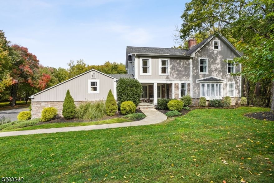 Your Dream Home Awaits! Sitting on almost 1.5 luscious acres, with a beautiful in-ground pool, picturesque views, and privacy, you will never want to leave home.  A perfect blend of historic charm & immaculate modern renovations greets you upon entering. Abundant natural light warms the space, with a statement wood burning fireplace, as the open concept living and dining room flow in the beautifully renovated Chef's kitchen. Stainless steel appliances, quartz counters, and a built in breakfast bar. This home is perfect for generational living, with a complete first floor ensuite and private full bath. Upstairs you will find four oversized bedrooms, including an expansive master suite with a gorgeous private bathroom and walk-in closet. Outside you will find your own piece of paradise. This backyard wonderland is complete with a fire pit, stunning slate patio, and IN GROUND POOL! This home is nestled on a stunning wooded lot yet not far from major highways, transportation, and shops & restaurants. Enjoy Blue Ribbon Schools & Easy access to NYC. Make this your sanctuary today!