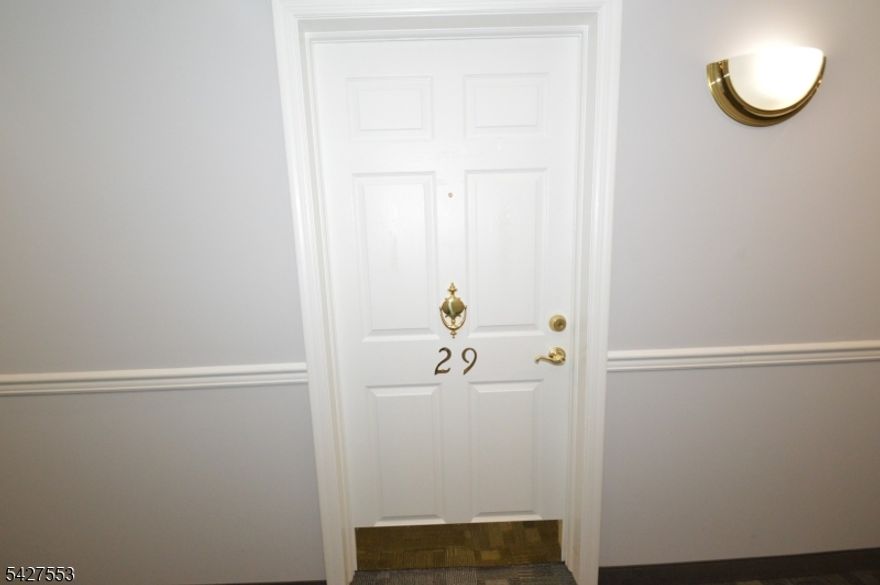 Spacious Two bedroom unit in front of building features open floor plan, new paint & carpet, kitchen w/Oak Cabs, DW, Refrigerator & large pantry closet, private balcony... Laundry on each level, Community Room offers great place to gather and enjoy recreation activities including pool table & exercise room? Back paver patio overlooks pond & Gazebo, offering additional seating & gas grill.. Easy walk to town & train!