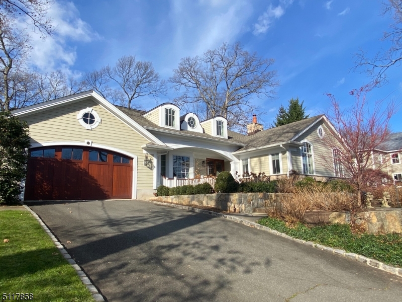 Stunning Custom Colonial completely gut renovated/seamlessly expanded in 2010 on fabulous, expansive property located in Upper Oak Ridge 'Circle Of Friends' neighborhood. Spacious & airy rooms, great natural light, high-end finishes throughout.  Foyer opens to a large DR & LR w/gas FP.  Stunning designer kitchen is fitted w/top-of-the-line appliances, breakfast area w/patio access, a walk-in pantry, nearby mud room w/direct entry from the att 2-car garage & convenient OFC/Laundry Rm.  Kitchen opens to Family Rm w/gas FP & a tucked away wood paneled Library/2nd OFC.  Elegant 1st flr Primary Suite w/LUX master BA, 2 WIC's w/organizer systems. On 2nd, 4BRs (3 en suite) all with large closets fitted w/organizer systems, plus walk-in attic storage, second laundry rm.  Fin LL rec rm, craft rm & utility/storage spaces.  Amazing, parklike level & fenced backyard surrounded by lush landscape for exceptional privacy.  Conveniences & amenities include high end lighting throughout, custom trim/millwork/built-ins/doors/cabinetry, new hardware, upstairs/downstairs laundry rooms, audio/security systems, whole house generator, professionally designed walkways, hardscape/landscape & patio area...too much to list!.  This house is DONE & move-in ready!