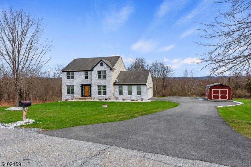 Discover this move-in ready Colonial in the desirable Rolling Hills Estates Subdivision. Surrounded by serene wooded areas on 1.78 Acres, this beautifully updated home offers Kitchen with Granite Countertops, Stainless Steel Appliances, Gas Fireplace, 4 Bedrooms, 3 1/2 Bathrooms, freshly painted interior and a finished walk out Basement featuring a full bath, Recreation Room and Exercise Room, ready for entertaining. New Septic in 2021. Located just minutes from High Point State Park, Mountain Creek Park, Appalachian Trails, and Minerals Spa, this home provides easy access to year-round outdoor activities.