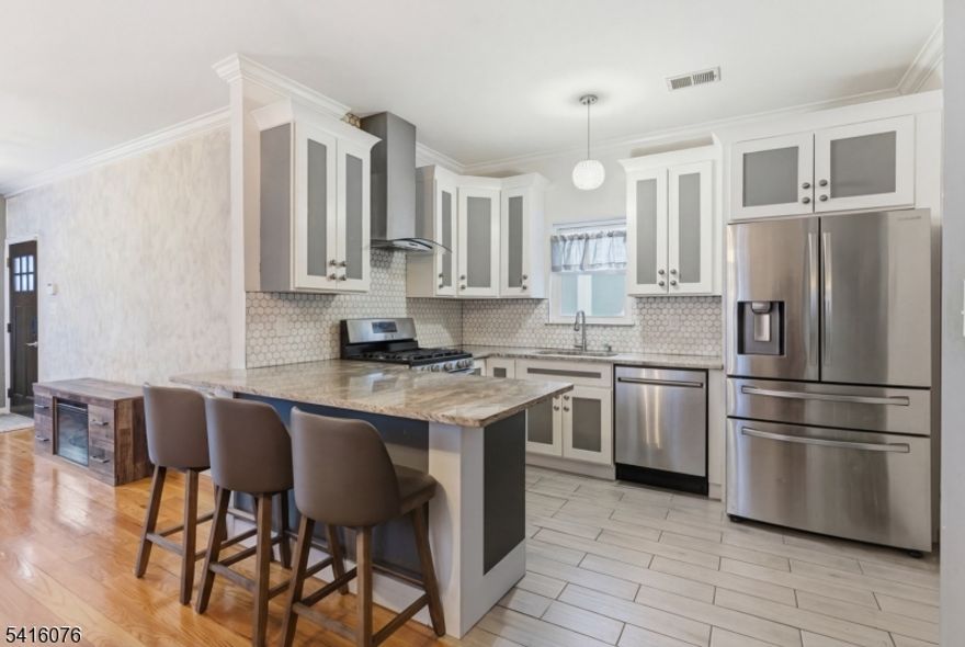 Newer-built semi-custom two-family located in a desirable section of Elizabeth. Well maintained with hardwood floors, central air, and open-concept living and dining areas. Modern kitchens, spacious bedrooms, and excellent natural light throughout. Ideal for owner-occupants or investors seeking a low-maintenance property with strong rental potential. Conveniently located near transportation, shopping, and major highways.