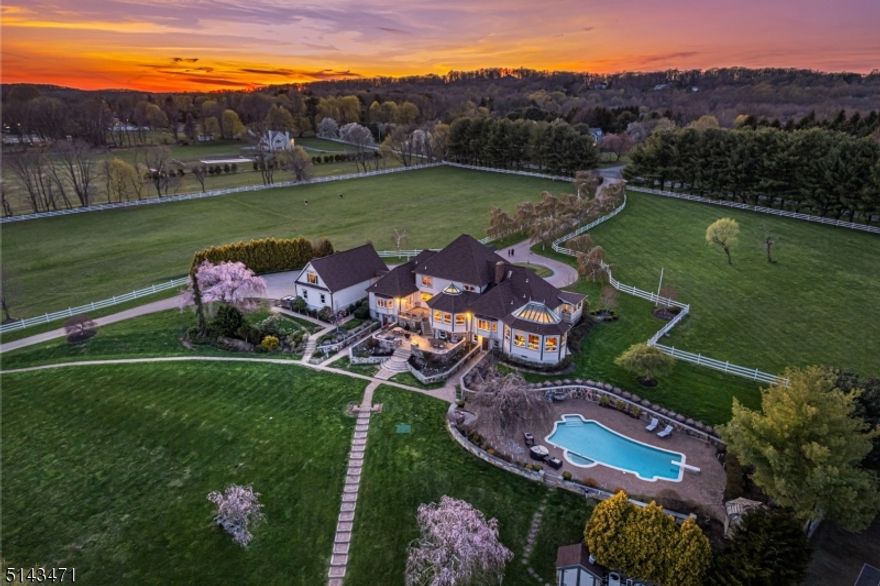 "Looking Glass Pond" is an exceptional resort like estate set serenely on  over 75 acres of preserved farmland in the heart of Tewksbury, offering sophisticated country living at its finest. This stunning 7 bd, 6 full bath home will delight with it's breathtaking pastoral views overlooking pool, tennis, pond, gardens, stone walls and lush landscapes. The long tree lined circular drive connects the home to the 8 stall barn, run in sheds and fenced pasture with riding ring.  Step inside to find and expansive Chef's kitchen and breakfast room complete with custom cabinetry, Subzero and Viking appliances leading to a light filled family room and conservatory. Extensive custom moldings enhance the architectural details of the conservatory ceiling. The sprawling first floor master suite boasts a newly renovated master bath with w/in closet featuring Toto fixtures and a steam shower. The private master sitting room provides a peaceful place to gaze out over the farm. A large recessed glass enclosed gym adjoins the sitting room. On this floor you'll find an office, au pair suite and large mud room. A second office is located over the three car garage. Upstairs are 4 bedrooms with ensuite baths. A finished w/out lower level w/ WB fireplace, tray ceiling also contains a full guest apartment w/ separate entrance.  Jaw dropping views looks out over hundreds of acres of  open farmland and is adjacent to park and riding trails. Simply one of a kind!