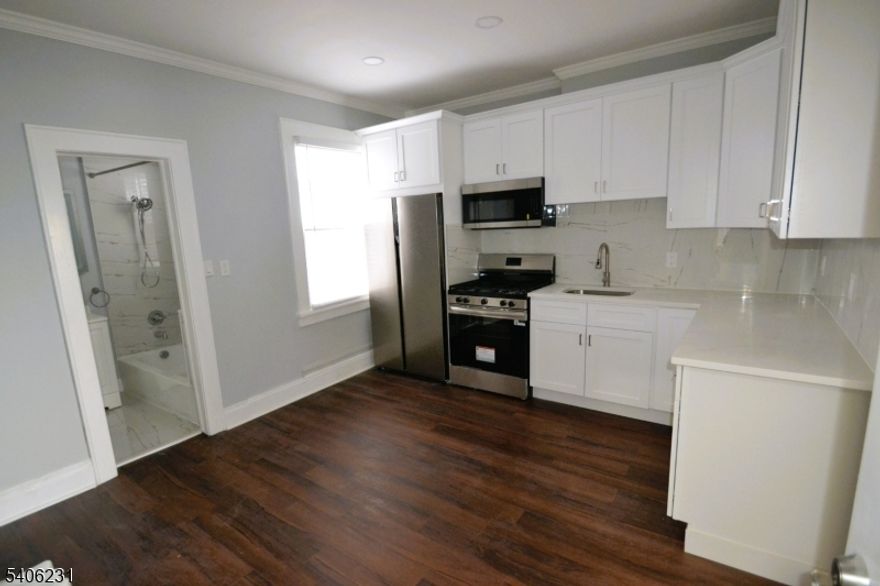 Step into this immaculate, fully renovated second-floor residence. Featuring two spacious bedrooms and a sleek, modern bathroom, this apartment offers the perfect blend of style and ease. Why you'll love it: Move-In Ready: Completely updated interiors mean you can settle in immediately without lifting a finger. Prime Location: Enjoy unbeatable access to transit, highways, shopping, and local parks everything you need is right at your doorstep. Rare finds like this don't stay on the market long. Don't let this opportunity slip away. Schedule your private tour today.